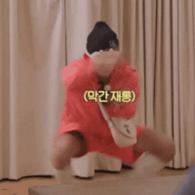 Man In Red Dress And Hat Jumping GIF