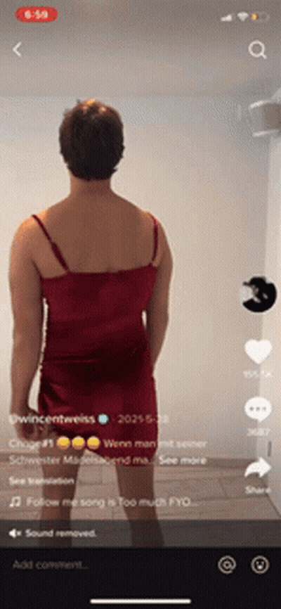Man In Red Dress Standing In Front Of Wall GIF