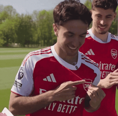 Man In Red Emirates Fly Better Jersey GIF