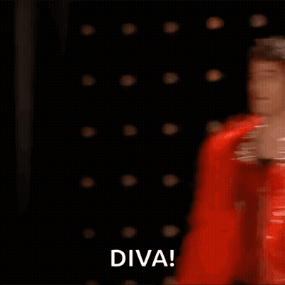 Man In Red Feather Boa Dancing On Stage Saying Diva GIF