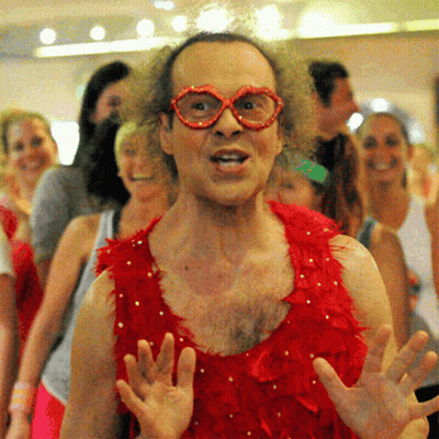 Man In Red Feathers And Glasses GIF