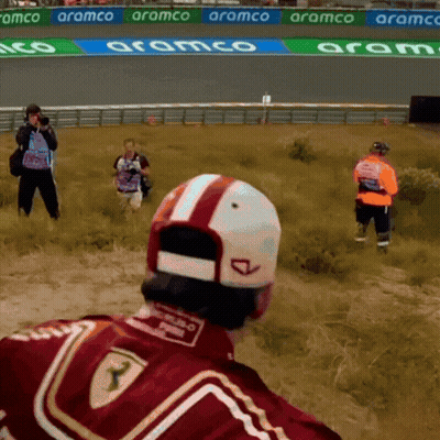 Man In Red Ferrari Jacket In Field GIF
