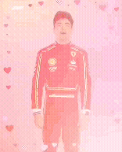 Man In Red Ferrari Suit With Hearts GIF