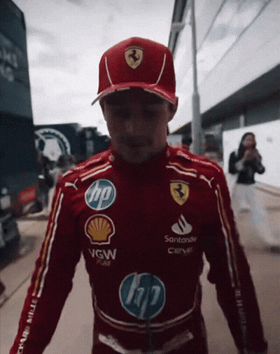 Man In Red Ferrari Uniform And Hat GIF