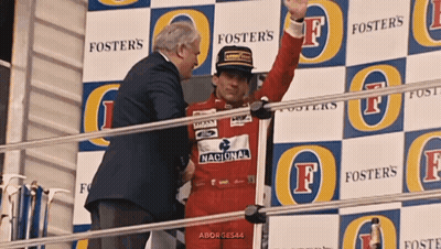 Man In Red Foster's Uniform On Stage GIF