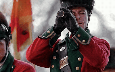 Man In Red-Green Military Uniform Using Telescope GIF