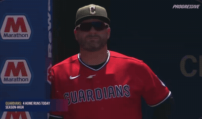 Man In Red Guardians Jersey With Marathon Sign GIF