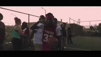 Man In Red Hamilton Jersey Holding Basketball GIF