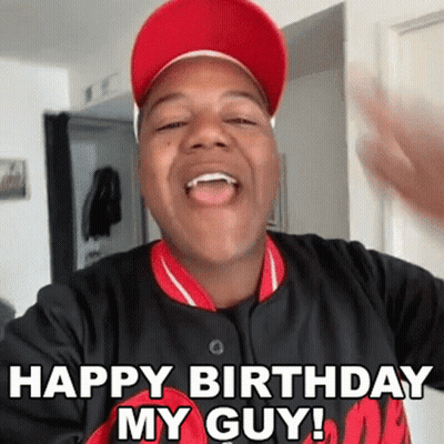 Man In Red Hat And Black Shirt Making Funny Face Saying Happy Birthday My Guy GIF