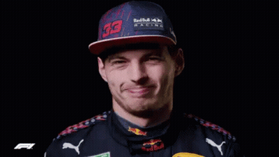 Man In Red Hat And Black Shirt Smiling GIF