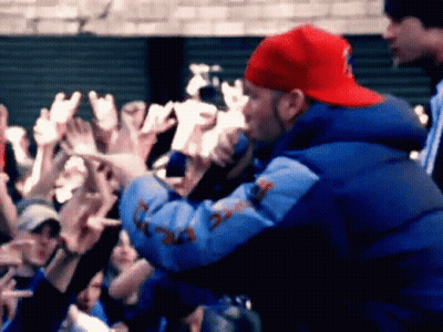 Man In Red Hat And Blue Jacket Singing GIF