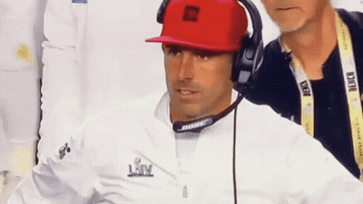 Man In Red Hat And Bose Headphones Looking GIF