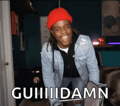 Man In Red Hat And Denim Jacket Saying Guiiidamn GIF