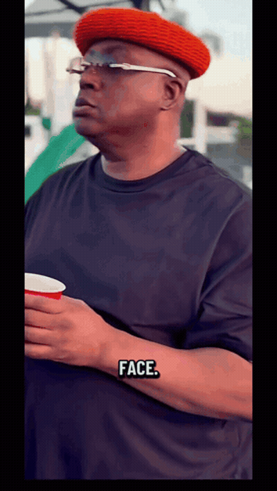 Man In Red Hat And Glasses Holding Cup Saying Face GIF