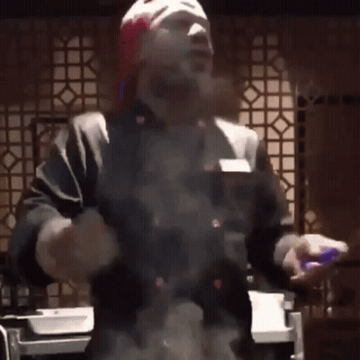 Man In Red Hat And Gloves Cooking GIF