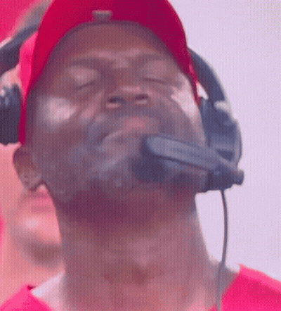 Man In Red Hat And Headphones Looking Up GIF