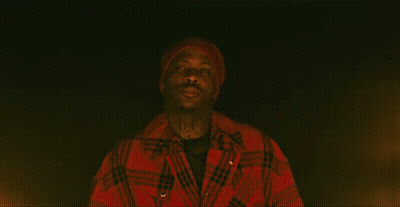 Man In Red Hat And Jacket Looking In Darkness GIF
