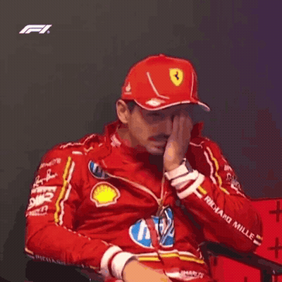 Man In Red Hat And Jacket Sitting GIF