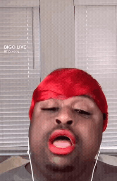 Man In Red Hat And Red Lipstick Singing GIF