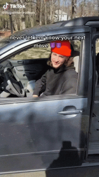Man In Red Hat And Sunglasses Driving Car GIF
