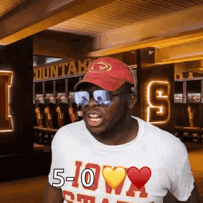 Man In Red Hat And Sunglasses Wearing 5-0 Shirt GIF