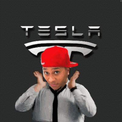 Man In Red Hat And Tie With Tesla Logo GIF