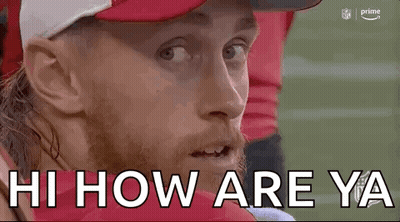 Man In Red Hat And White Hat Sitting On Football Field GIF