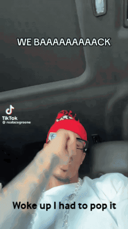 Man In Red Hat And White Shirt In Car Saying We Baaaack GIF