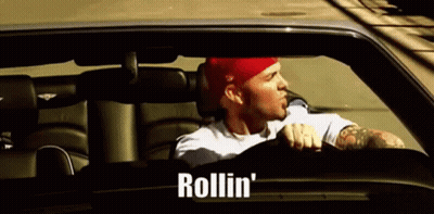 Man In Red Hat Driving Car With Rollin GIF