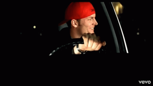 Man In Red Hat Driving Vevo Car GIF