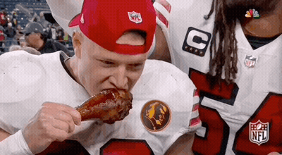 Man In Red Hat Eating Chicken Wing GIF
