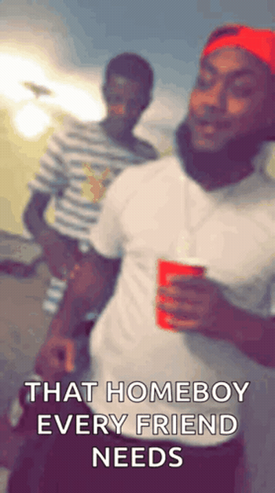 Man In Red Hat Holding Red Cup Next To Man In Striped Shirt GIF