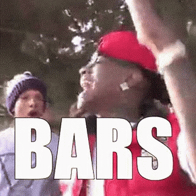 Man In Red Hat Holding Stick With Bars GIF