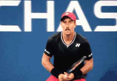 Man In Red Hat Holding Tennis Racquet Chas Sign GIF