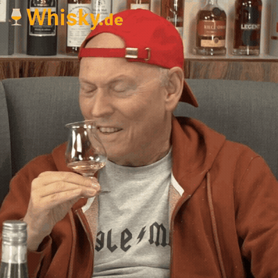 Man In Red Hat Holding Whiskey Glass GIF