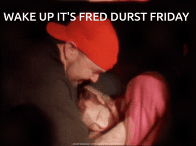 Man In Red Hat Hugging Woman Saying Wake Up It's Fred Durst Friday GIF