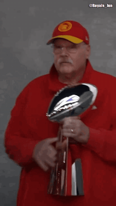 Man In Red Hat Kissing NFL Trophy GIF