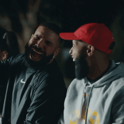 Man In Red Hat Laughing Next To Another Man GIF
