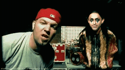 Man In Red Hat Next To Woman GIF
