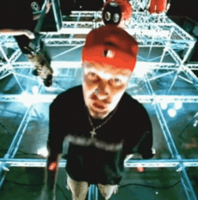 Man In Red Hat On Stage Looking Up GIF