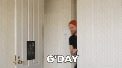Man In Red Hat Peeking Out Of Door GIF
