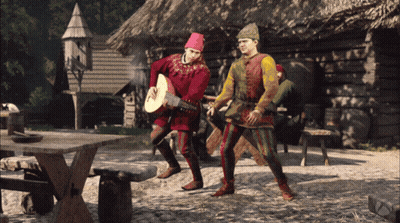 Man In Red Hat Playing Guitar With Another Man Behind GIF