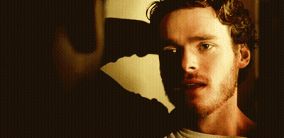 Man In Red Hat Reading Book To Red Hat Men GIF