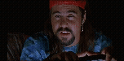 Man In Red Hat Says Slurpee In Dark Room GIF