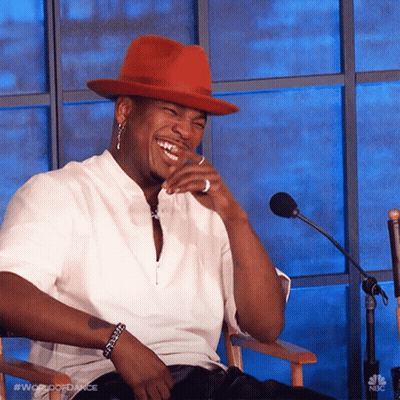 Man In Red Hat Sitting At Microphone GIF
