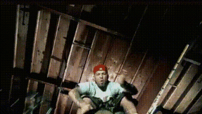 Man In Red Hat Sitting On Wooden Floor GIF