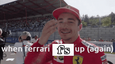 Man In Red Hat Smiling When Ferrari Fs Up Again GIF