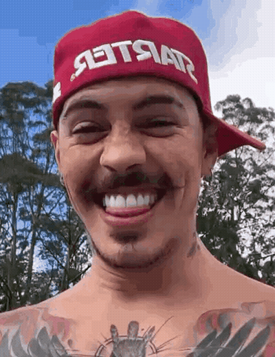Man In Red Hat Smiling With Tongue Out GIF
