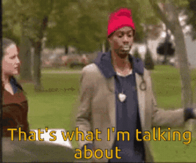 Man In Red Hat Talking To Woman GIF