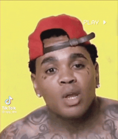 Man In Red Hat With Face Tattoo Making Funny Face GIF